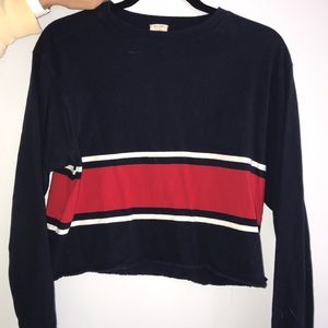 Red white and blue cropped long sleeve shirt.